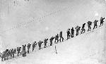 people climbing snow slope, 1897
