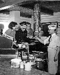 Black and photo of man at a diner