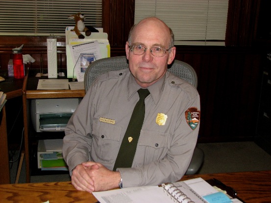 Photo of Ranger Reed McCluskey at his desk.