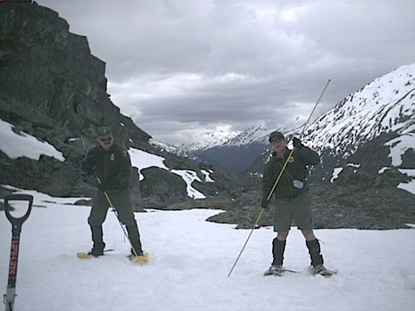 Rangers testing the snow on the Chilkoot Trail