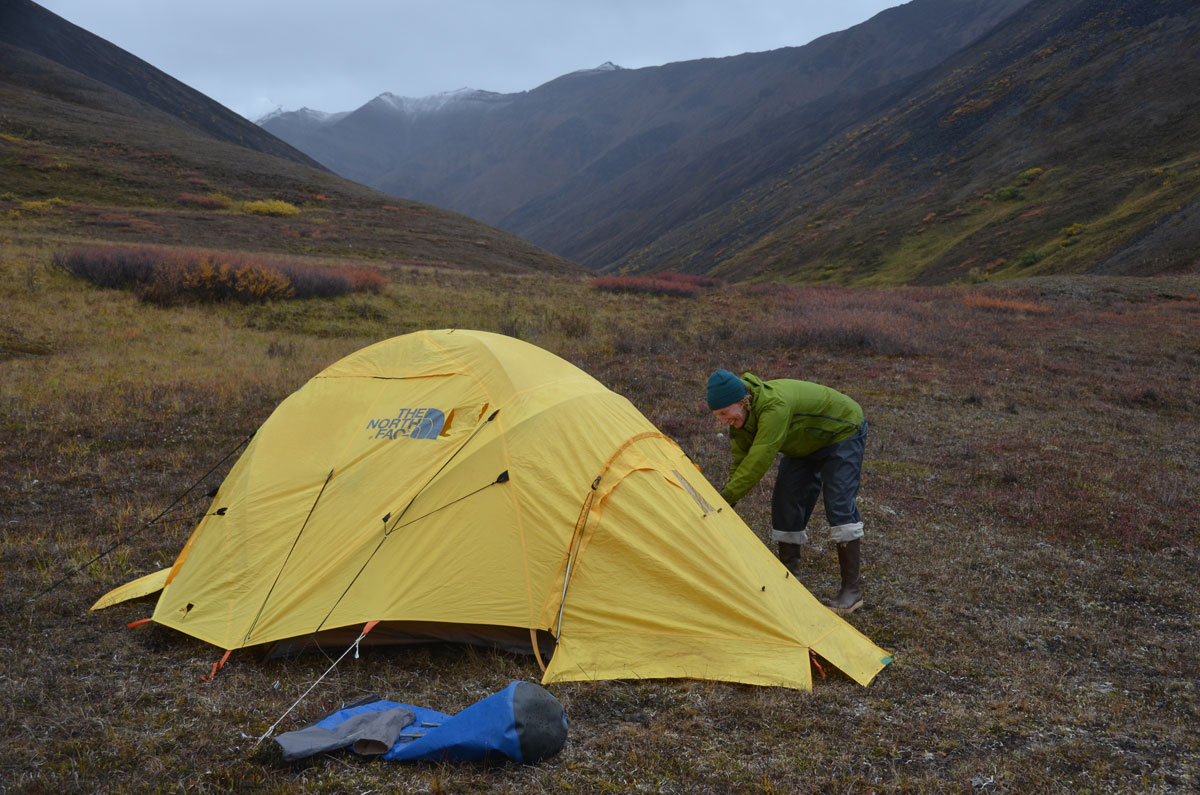 MK MacNaughton pitching a tent in the backcountry