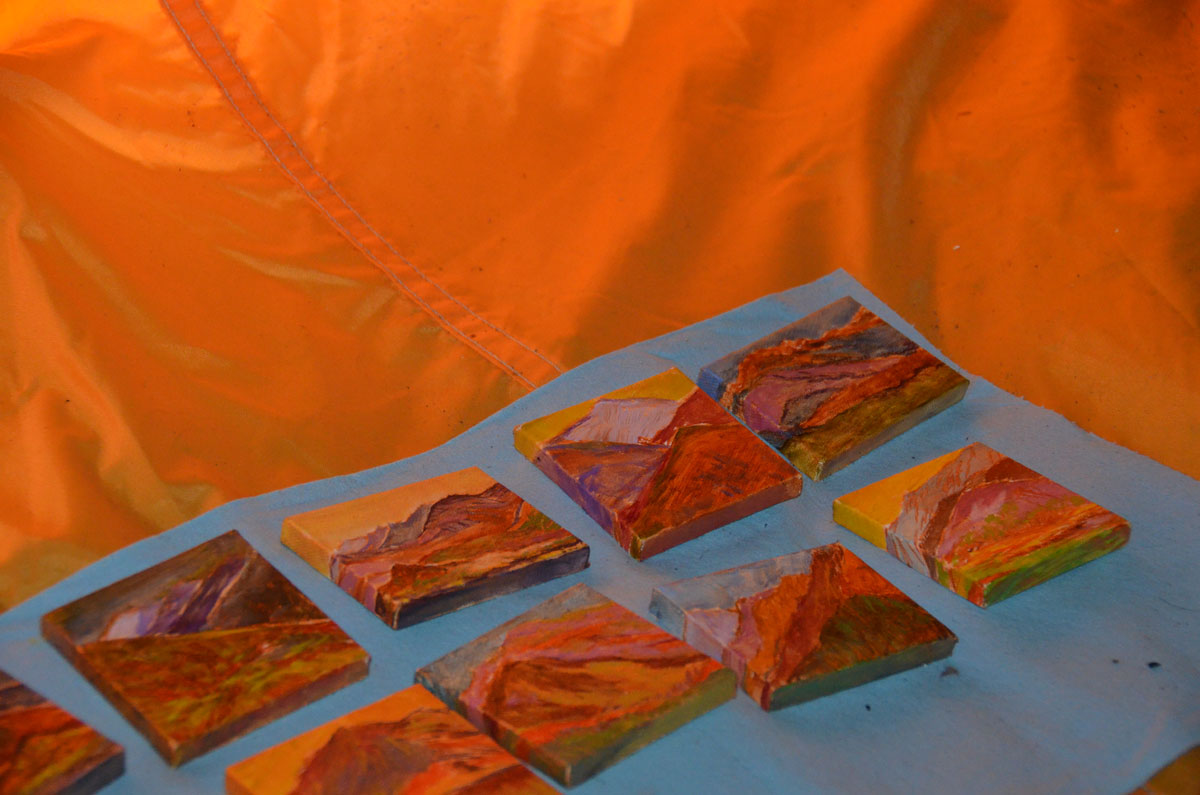 Paintings drying in the tent