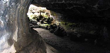 A photo of the opening of Valentine Cave with stairs in the distance at the cave exit.