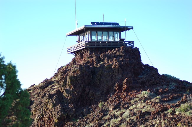 Square lookout tower on top of basalt rock