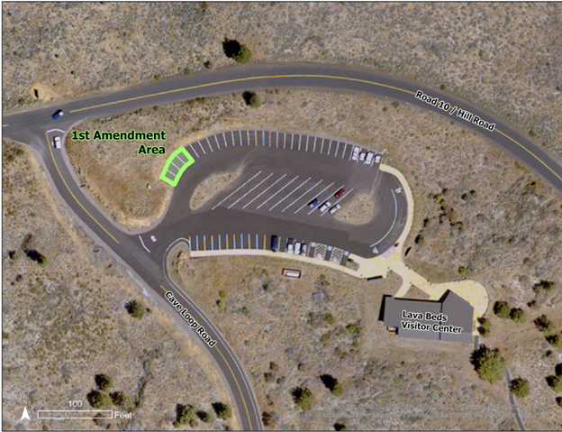 Aerial image of visitor center and parking lot, with the 1st amendment area highlighted in the northwestern corner of the parking lot.