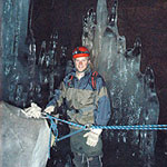 Visitor below the first icy slope of the cave Visitor below the first icy slope of the cave