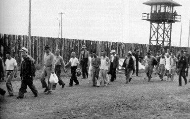 People of Japanese decent being moved from one area to another in the incarceration camp circa 1942.