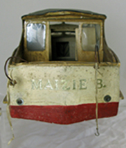 wooden model boat, viewed from the stern. the words Maizie B are visible in gold paint