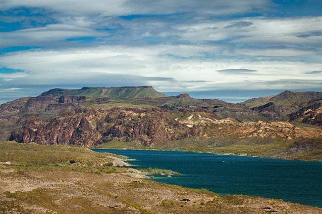 Photo of Colorado River flowing between hills and foreground