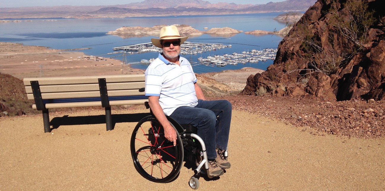 man in wheelchair on trail