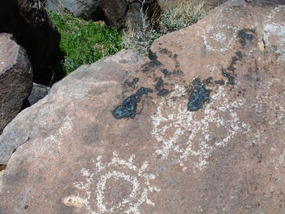 Paint splatters on a petroglyph panel in Grapevine Canyon