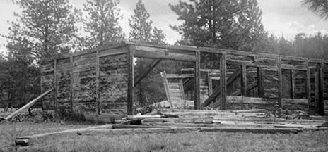 St. Paul's Mission in ruins. Log walls in pieces. Black and white.