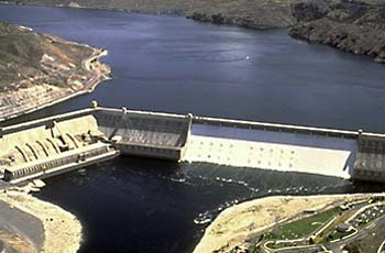 Ariel view of the Grand Coulee Dam looking from the down river side. Lake Roosevelt pools behind the dam.