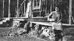 b/w photo of Ida May Sifford on porch of lodge