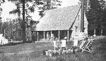 bw photo of front porch of rustic Drakesbad Lodge