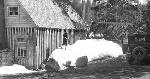bw photo of woman posing on large snow pile