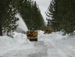 snow plows move 5 foot deep snow from road