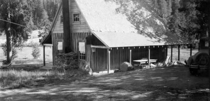 black and white photo showing rustic cabin in 1931