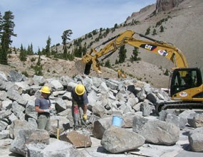 Park trail crew move prepare stone from a nearby quarry