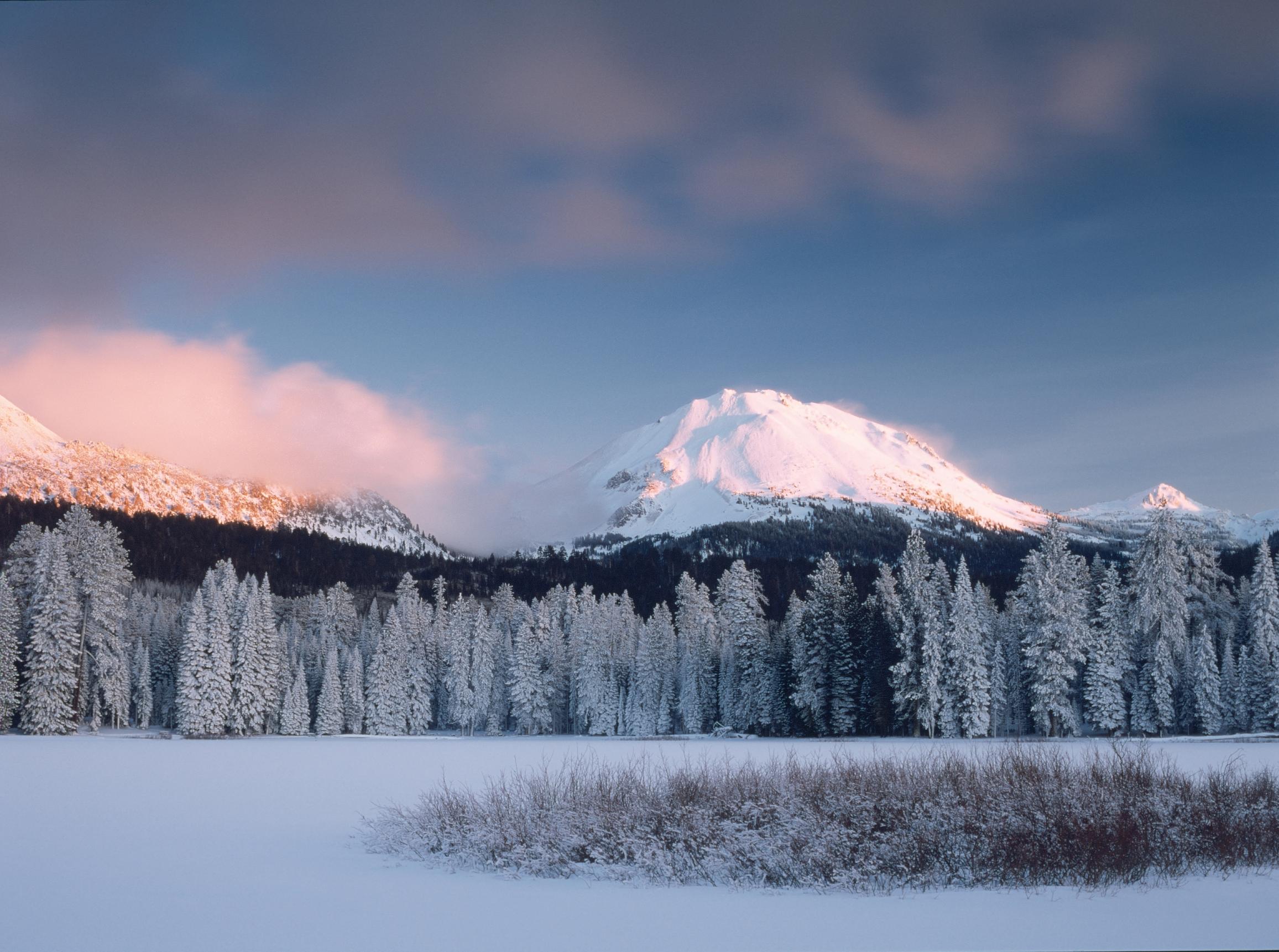 winter image with fresh snow over lake and Lassen Peak in background