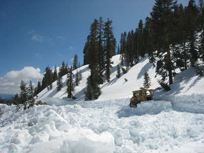 Heavy equipment cuts road into deep snow near the Sulphur Works