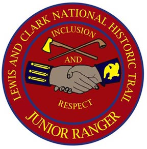 Junior ranger patch showing clasped hands, a pipe, and an axe with the words inclusion and respect on a red background.
