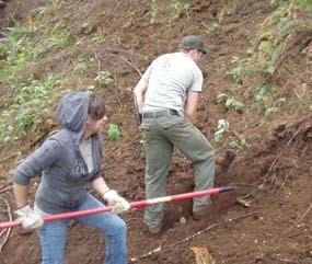 YCC student Angelica & Park Ranger Josh raking and building South Clatsop Slough trail.