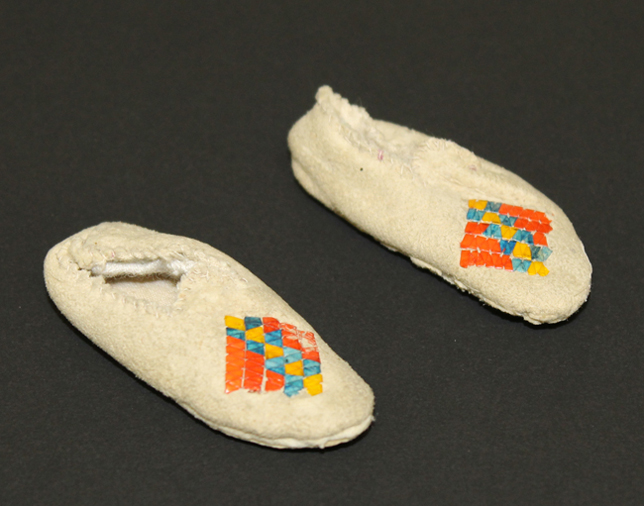 A pair of miniature moccasins sent to Henry Wadsworth Longfellow by missionary Mary Collins in 1882.