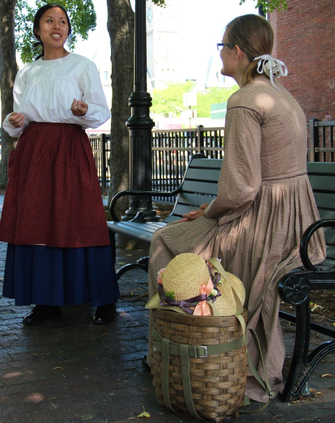 Two youths in historic costumes.