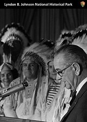 Native Americans watch as President Johnson delivers a speech.