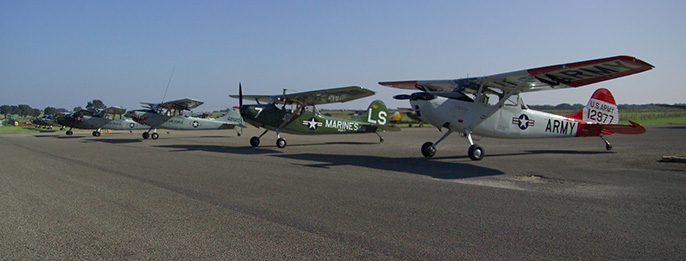 Bird Dog planes lined up on the airstrip at the LBJ Ranch