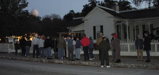 Visitors wait to enter the Boyhood Home, decorated for Christmas.