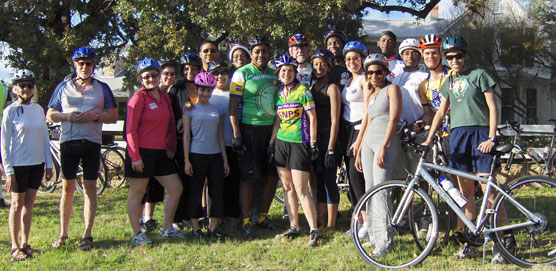 Luci Johnson stands with a group of cyclists in front of the Texas White House. Luci Johnson stands with a group of cyclists in front of the Texas White House.