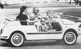 President Johnson takes daughter Luci and grandson Lyndon Nugent for a drive
