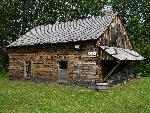 house built from stacked hewn logs