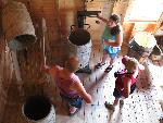 guide explaining barrels display to two visitors