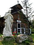 statue in front of small church
