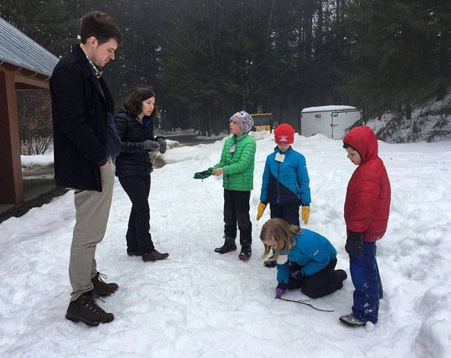 Kids with park interns at Forest Center in winter