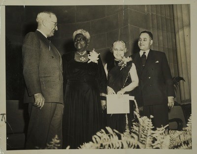 President Harry S. Truman, Mary McLeod Bethune, Madame Vijaya Pandit, and Ralph Bunche at NCNW's International Night event on November 18, 1949.