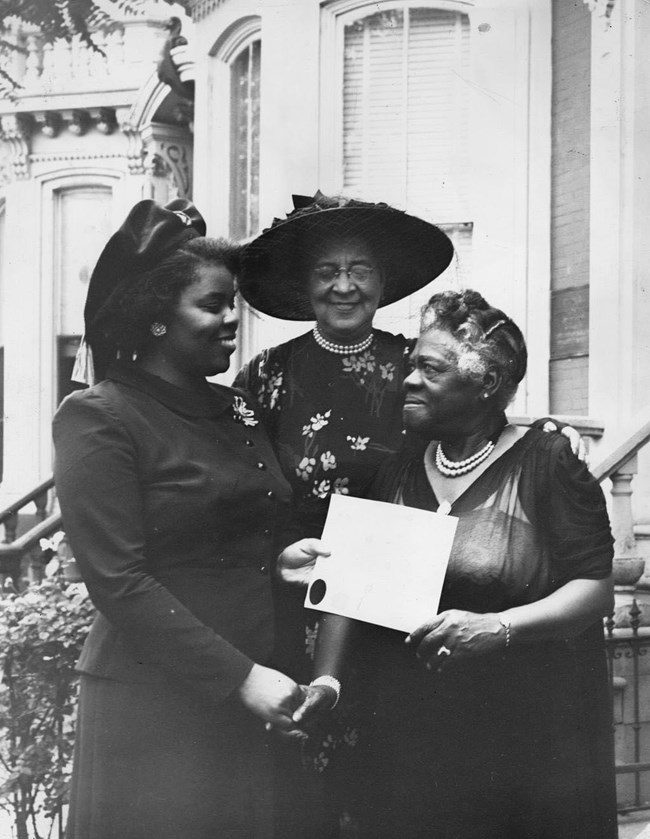 Mary McLeod Bethune presents NCNW Roll of Honor Awards to Carol Brice and Eleanor Daily