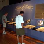 People in visitor center reading exhibit