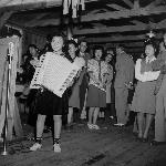 Young woman with large accordian