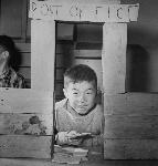 Boy smiles and holds a letter