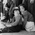 Two girls with the crowd behind