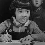 A third grade student at Manzanar. Photo by Francis Stewart.