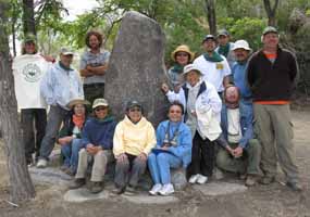 The Nishi family and other volunteers gather in front of one of the cornerstones of Merritt Park.