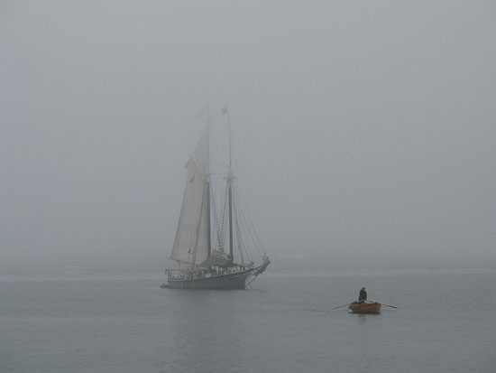 The schooner Lewis R. French and a rowboat in foggy weather