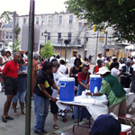 Visitors at the water table at Maggie Walker birthday celebration.