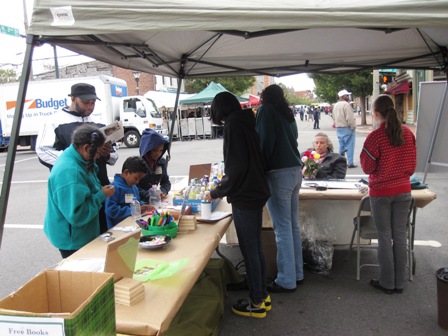 Volunteers working the craft table at the 2nd Street Festival.