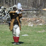Park Ranger firing a musket